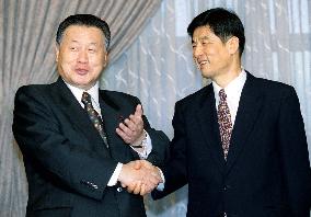 Mori meets Xinhua president